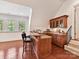 Charming bar area with custom cabinets, seating, and natural light, ideal for casual entertaining at 9000 Whirlaway Ln, Waxhaw, NC 28173