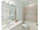 Bathroom featuring a tub/shower combo, a vanity with a sink, and neutral tile flooring at 9000 Whirlaway Ln, Waxhaw, NC 28173