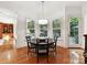 Bright breakfast nook with views of the outdoors with a round table and seating at 9000 Whirlaway Ln, Waxhaw, NC 28173