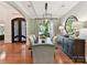 Formal dining room boasts hardwood floors, a stylish light fixture, and sophisticated decor at 9000 Whirlaway Ln, Waxhaw, NC 28173