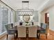 Elegant dining room featuring hardwood floors, a modern light fixture, and stylish decor at 9000 Whirlaway Ln, Waxhaw, NC 28173