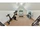 Bright exercise room with workout equipment and natural light, ideal for a home fitness center at 9000 Whirlaway Ln, Waxhaw, NC 28173
