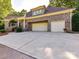 Well-maintained brick home with a spacious three-car garage and meticulously landscaped front yard at 9000 Whirlaway Ln, Waxhaw, NC 28173