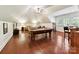 Bright game room with a pool table, lounge area, and bar-style seating, great for entertainment at 9000 Whirlaway Ln, Waxhaw, NC 28173