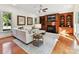 Comfortable Gathering room with built-in shelving, a fireplace, a ceiling fan, and plenty of natural light at 9000 Whirlaway Ln, Waxhaw, NC 28173