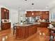 Spacious kitchen with wood cabinets, stainless steel appliances, and granite countertops at 9000 Whirlaway Ln, Waxhaw, NC 28173