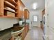 Laundry room with stainless steel appliances, storage, and tiled floor at 9000 Whirlaway Ln, Waxhaw, NC 28173