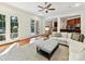 Inviting living room with hardwood floors, a plush sofa, an area rug, and backyard access at 9000 Whirlaway Ln, Waxhaw, NC 28173