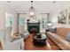 Cozy living room with hardwood floors, fireplace, natural light, and comfortable seating arrangements at 9000 Whirlaway Ln, Waxhaw, NC 28173