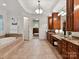 Main bathroom with tiled floors, granite countertops and access to walk-in closet at 9000 Whirlaway Ln, Waxhaw, NC 28173