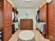 Walk-in closet with custom wood storage and organization system at 9000 Whirlaway Ln, Waxhaw, NC 28173