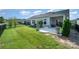 A spacious backyard with well-maintained green lawn and patio seating area at 9311 Dunwich Dr, Gastonia, NC 28056
