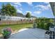Well-maintained backyard featuring a lush lawn, decorative planters and privacy fencing at 9311 Dunwich Dr, Gastonia, NC 28056
