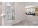 Cozy bathroom with a single vanity, toilet, and tiled floors, located near the living area at 9311 Dunwich Dr, Gastonia, NC 28056