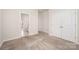 Carpeted bedroom leading to an ensuite bathroom and a wardrobe at 9311 Dunwich Dr, Gastonia, NC 28056