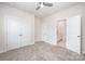 Bright bedroom featuring neutral walls, plush carpeting, and ensuite bathroom access at 9311 Dunwich Dr, Gastonia, NC 28056