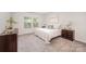 Inviting bedroom with a plush bed, neutral décor, and ample natural light from large windows at 9311 Dunwich Dr, Gastonia, NC 28056