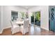 Cozy dining area with a modern table, seating for four, and sliding glass doors to the patio at 9311 Dunwich Dr, Gastonia, NC 28056