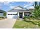 Attractive home exterior with stone and siding, a well-manicured lawn and inviting entrance at 9311 Dunwich Dr, Gastonia, NC 28056