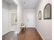 Inviting entryway featuring hardwood floors, neutral walls, and decorative mirrors at 9311 Dunwich Dr, Gastonia, NC 28056