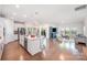 Open-concept kitchen with stainless steel appliances flows into the adjacent living area at 9311 Dunwich Dr, Gastonia, NC 28056