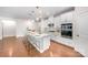 Stylish kitchen featuring a spacious island with bar stools and sleek stainless steel appliances at 9311 Dunwich Dr, Gastonia, NC 28056