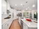 Bright, open kitchen with stainless steel appliances, a large island, and pendant lighting at 9311 Dunwich Dr, Gastonia, NC 28056