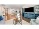 Bright, open living space with stylish furnishings, hardwood floors, and a view of the kitchen at 9311 Dunwich Dr, Gastonia, NC 28056