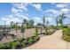 Community playground with various play structures and a swing set, surrounded by a black fence at 9311 Dunwich Dr, Gastonia, NC 28056