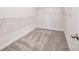 A functional walk-in closet with carpet and white wire shelving at 9311 Dunwich Dr, Gastonia, NC 28056