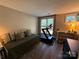 Versatile room features a daybed, treadmill, and ample natural light, perfect for fitness and relaxation at 1013 Park West Dr # 5, Charlotte, NC 28209