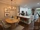 Bright kitchen opens to the dining area, featuring stainless appliances and wood flooring at 1013 Park West Dr # 5, Charlotte, NC 28209