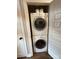 Efficient laundry closet with stacked washer and dryer, maximizing space at 1013 Park West Dr # 5, Charlotte, NC 28209