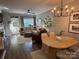 Inviting living area with hardwood floors, a large sectional sofa, and elegant lighting fixtures at 1013 Park West Dr # 5, Charlotte, NC 28209