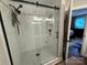 Modern bathroom featuring a glass shower with matte black fixtures and white tile at 1013 Park West Dr # 5, Charlotte, NC 28209