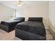 Bedroom with two beds and a window at 10409 Dominion Village Dr, Charlotte, NC 28269