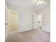 Neutral bedroom features carpet, ceiling fan, and entry to the ensuite bathroom at 10409 Dominion Village Dr, Charlotte, NC 28269