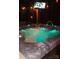 Hot tub with blue water and a fountain at 10409 Dominion Village Dr, Charlotte, NC 28269