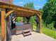 Covered hot tub with green grass in backyard at 10409 Dominion Village Dr, Charlotte, NC 28269