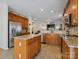 Well-equipped kitchen with stainless steel appliances, granite countertops, and an open view into the living space at 10409 Dominion Village Dr, Charlotte, NC 28269