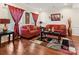 Bright living room with hardwood floors, comfortable sofas, and stylish decor at 10409 Dominion Village Dr, Charlotte, NC 28269