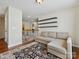 Spacious living area featuring modern shelves and an open view of the staircase at 10409 Dominion Village Dr, Charlotte, NC 28269