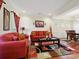 Comfortable living room featuring hardwood floors, cozy seating, and an open layout at 10409 Dominion Village Dr, Charlotte, NC 28269
