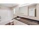 Bathroom featuring neutral tones, framed mirror, tub-shower combo, and granite vanity at 115 Dove Sw Ave, Concord, NC 28025
