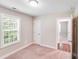 Bright bedroom with a closet, window, and a view to another room at 115 Dove Sw Ave, Concord, NC 28025