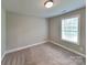Clean and simple carpeted bedroom with a window view at 115 Dove Sw Ave, Concord, NC 28025