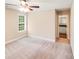 This bedroom boasts natural light with neutral walls and carpeted floors at 115 Dove Sw Ave, Concord, NC 28025