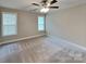 Cozy bedroom with carpeted floors and natural light from windows at 115 Dove Sw Ave, Concord, NC 28025