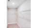 Walk in closet features white walls, carpet flooring, and metal shelving at 115 Dove Sw Ave, Concord, NC 28025