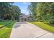 Landscaped home with gray siding, well-manicured lawn, and a spacious driveway at 115 Dove Sw Ave, Concord, NC 28025